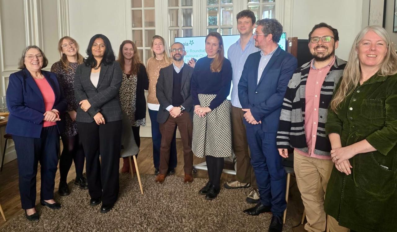 Event speakers standing in a semi-circle